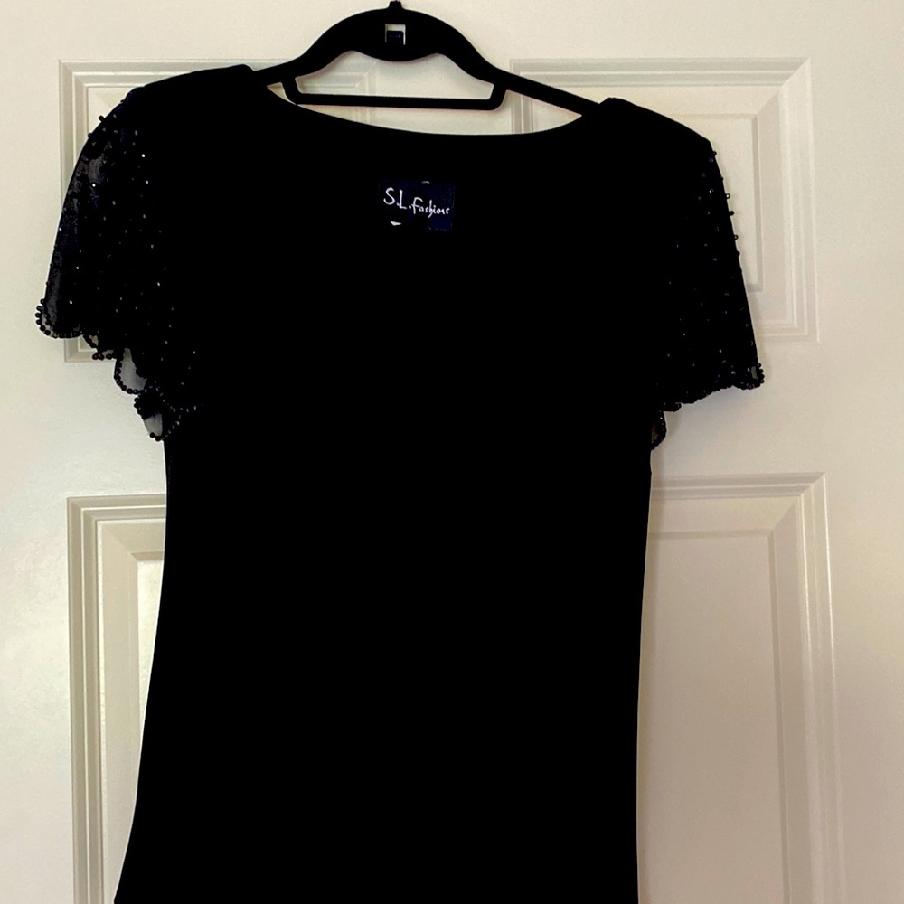Black blouse with sequins on shirt sleeves
